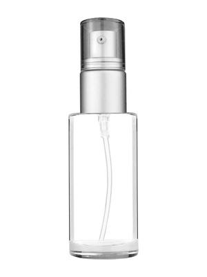 Cylinder design 30 ml 1oz  clear glass bottle  with with a matte silver collar treatment pump and clear overcap.