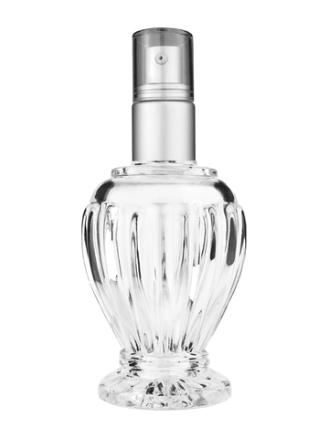 Diva design 100 ml, 3 1/2oz  clear glass bottle  with with a matte silver collar treatment pump and clear overcap.