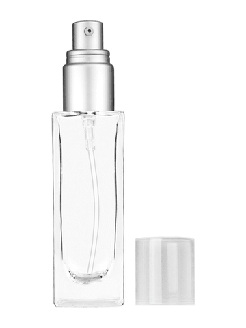 Sleek design 30 ml, 1oz  clear glass bottle  with with a matte silver collar treatment pump and clear overcap.