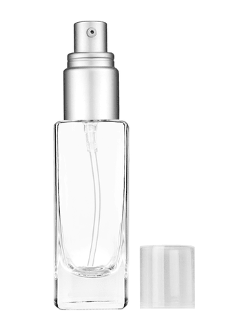 Slim design 30 ml, 1oz  clear glass bottle  with with a matte silver collar treatment pump and clear overcap.