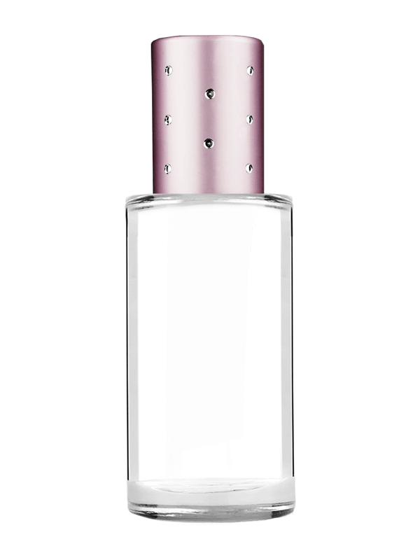 Cylinder design 9ml Clear glass bottle with metal roller ball plug and pink cap with dots.