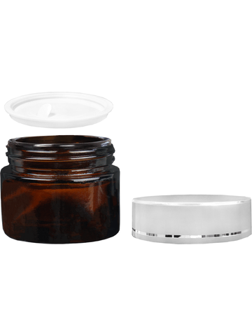 Glass, cream jar style 40 ml amber bottle with silver cap.